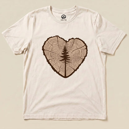 A graphic t-shirt featuring a tree ring design forming a heart shape, with a detailed tree silhouette in the center, labeled "Tree Ring Heart Shirt.