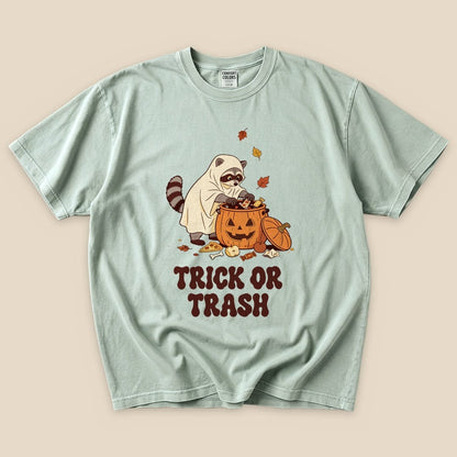 Bay Trick or Trash T-Shirt with a raccoon in a ghost costume raiding a pumpkin candy bucket graphic