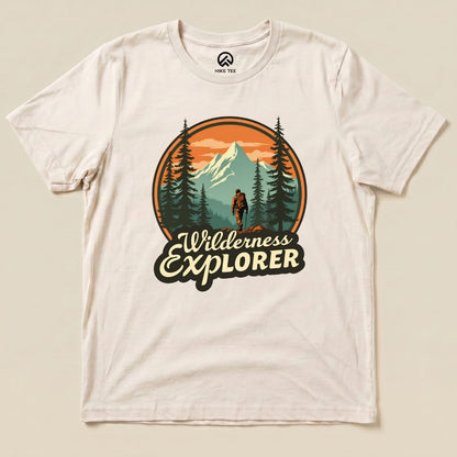 The Wilderness Explorer Shirt features a climber against a mountain backdrop with trees, highlighted in earthy tones.