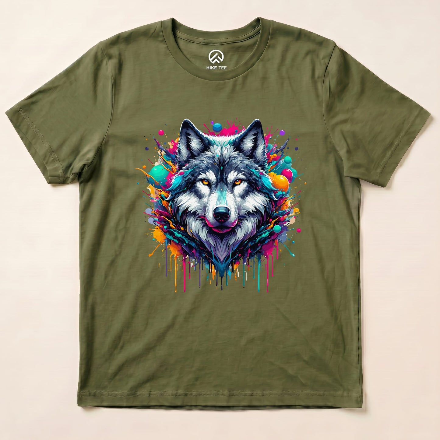 A graphic t-shirt in olive green featuring a vibrant wolf design surrounded by colorful splashes, labeled "Wolf Colorful Shirt.