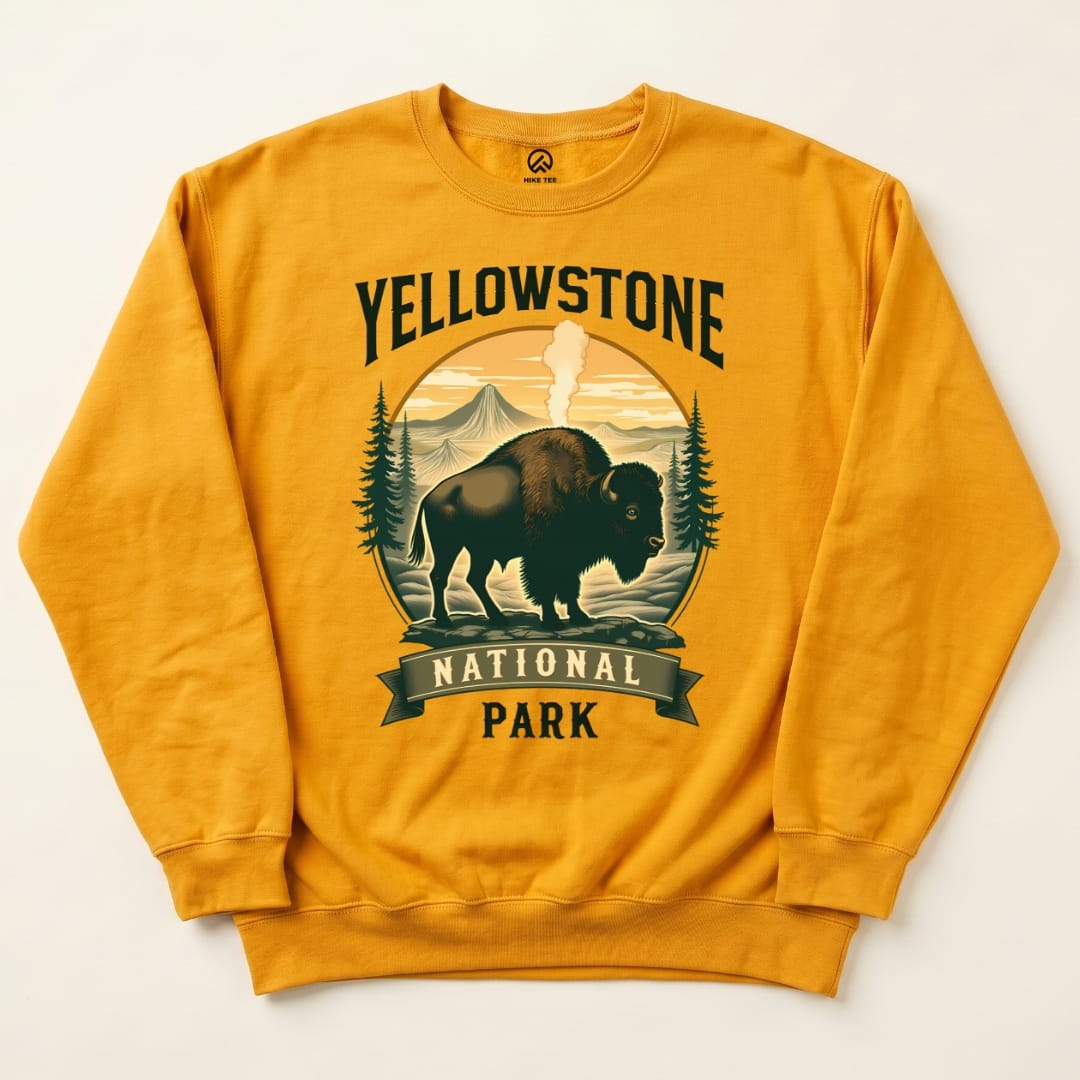 A yellow sweatshirt featuring a graphic of a bison with "Yellowstone National Park" text and a scenic background.