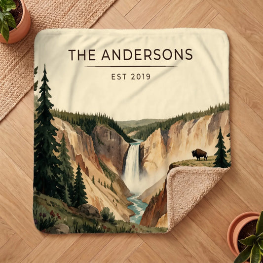 A cozy Sherpa blanket featuring a scenic view of Yellowstone Falls and a bison, ideal for any outdoor enthusiast.