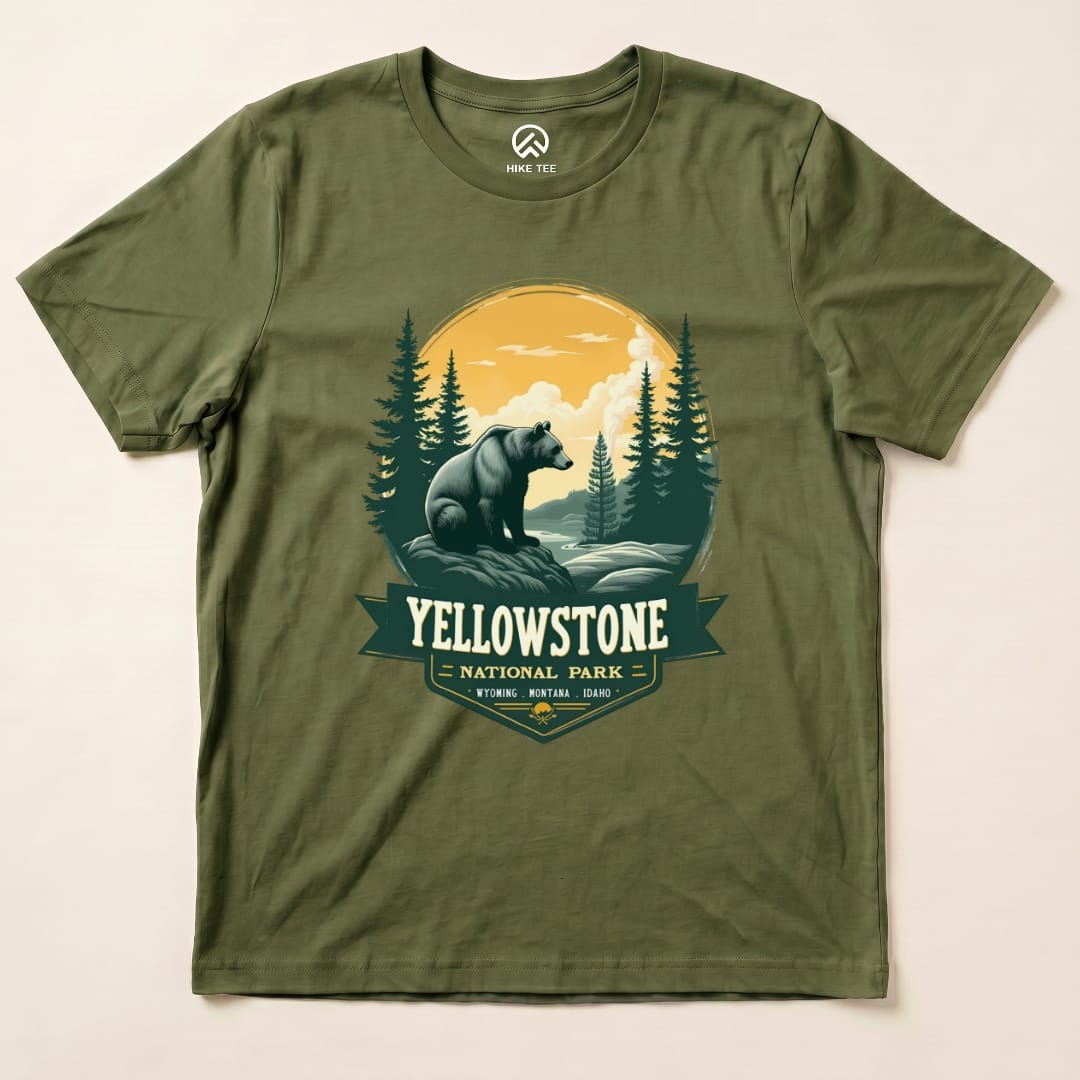 Graphic t-shirt featuring a Yellowstone Grizzly Bear design with trees and mountains, highlighting Yellowstone National Park.