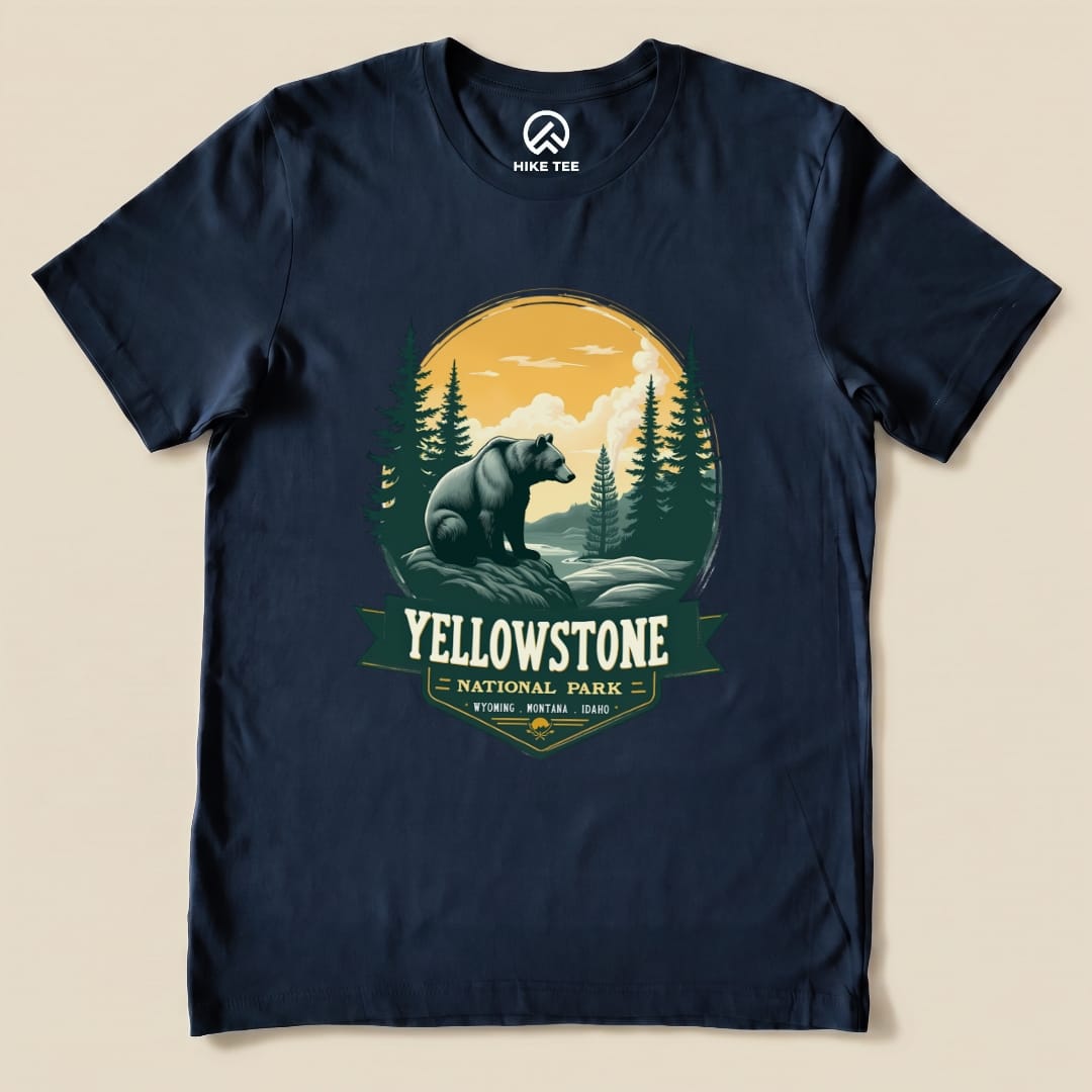 Navy graphic t-shirt featuring a Yellowstone Grizzly Bear design with trees and mountains, highlighting "Yellowstone National Park.