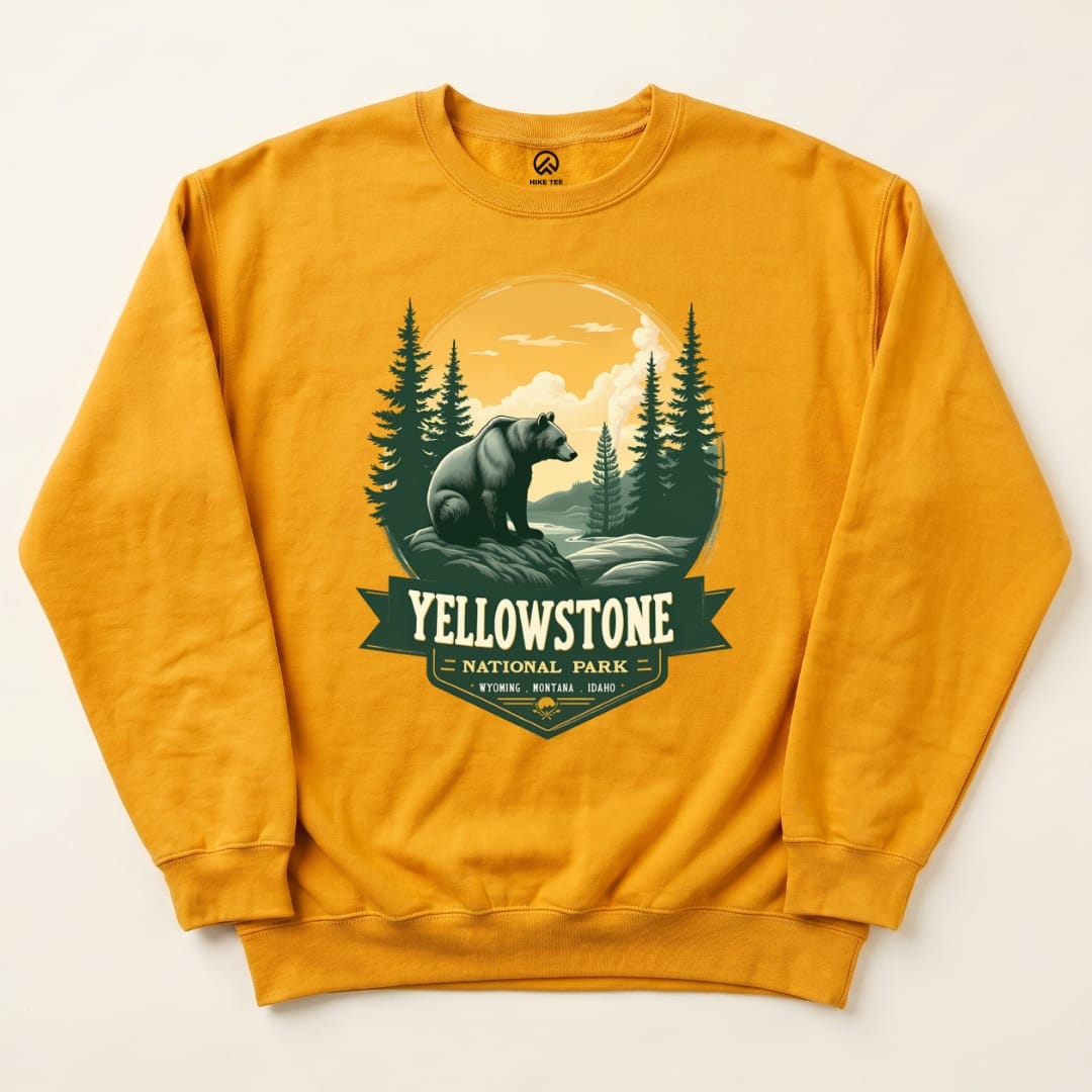 The "Yellowstone Grizzly Bear Sweatshirt" features a graphic of a bear set against a serene landscape with trees and mountains.