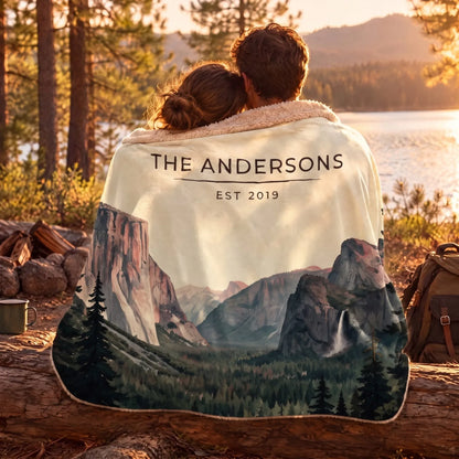 Couple wrapped in the Yosemite Tunnel View Sherpa Blanket by a lake