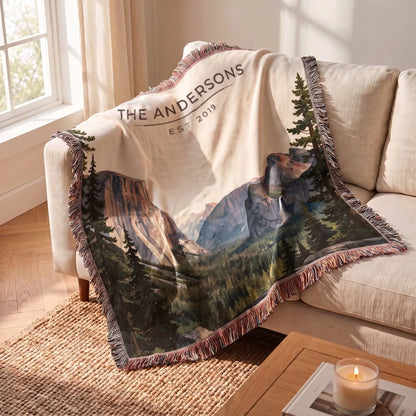 Yosemite Tunnel View Woven Blanket draped over a sofa