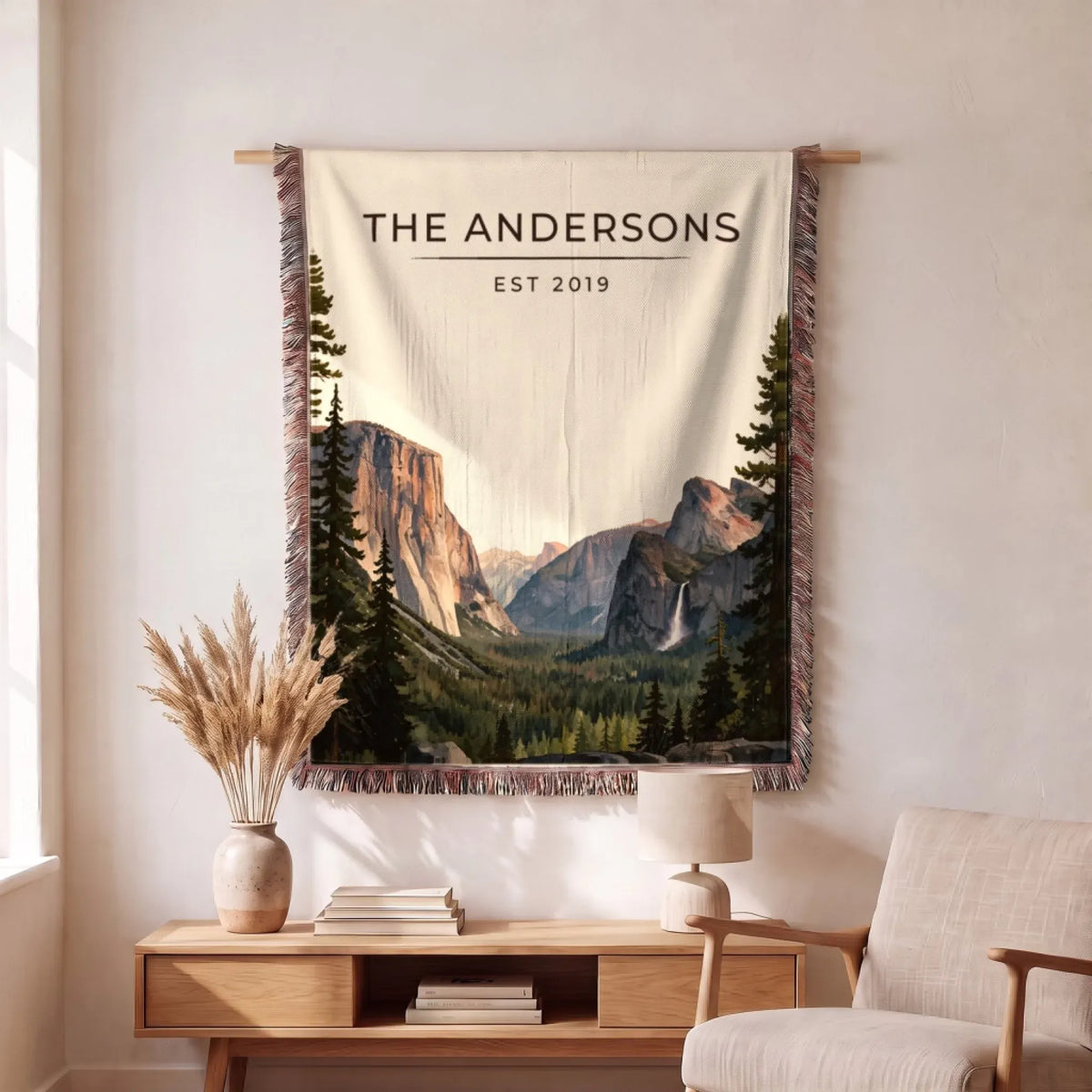 Personalized Yosemite Tunnel View Woven Blanket hanging on a wall, family name woven in