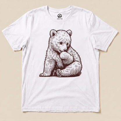A graphic t-shirt featuring a playful bear illustration, titled "Youth Bear Shirt," on a white background.