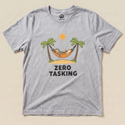 A graphic t-shirt featuring a sloth and cat lounging in a hammock under palm trees with the text "ZERO TASKING" below.