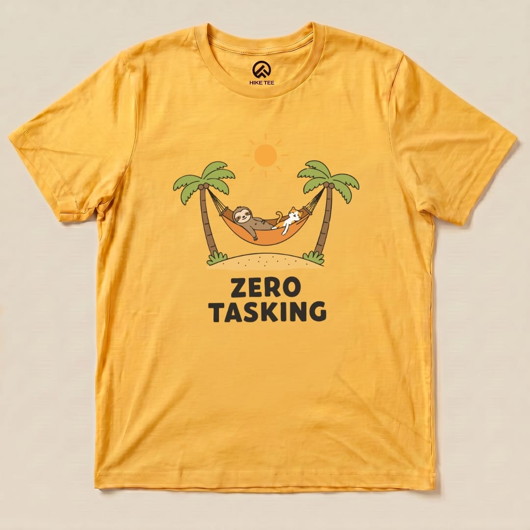 A yellow graphic t-shirt features a sloth and cat relaxing in a hammock under palm trees, with "ZERO TASKING" text below.