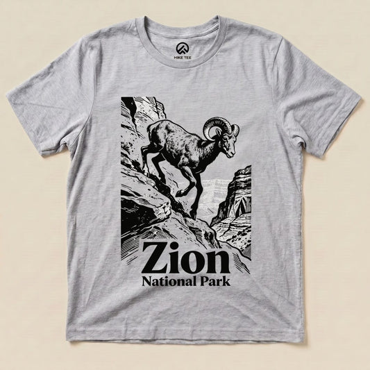A graphic t-shirt featuring a ram climbing rocky terrain, with "Zion National Park" text below the design.